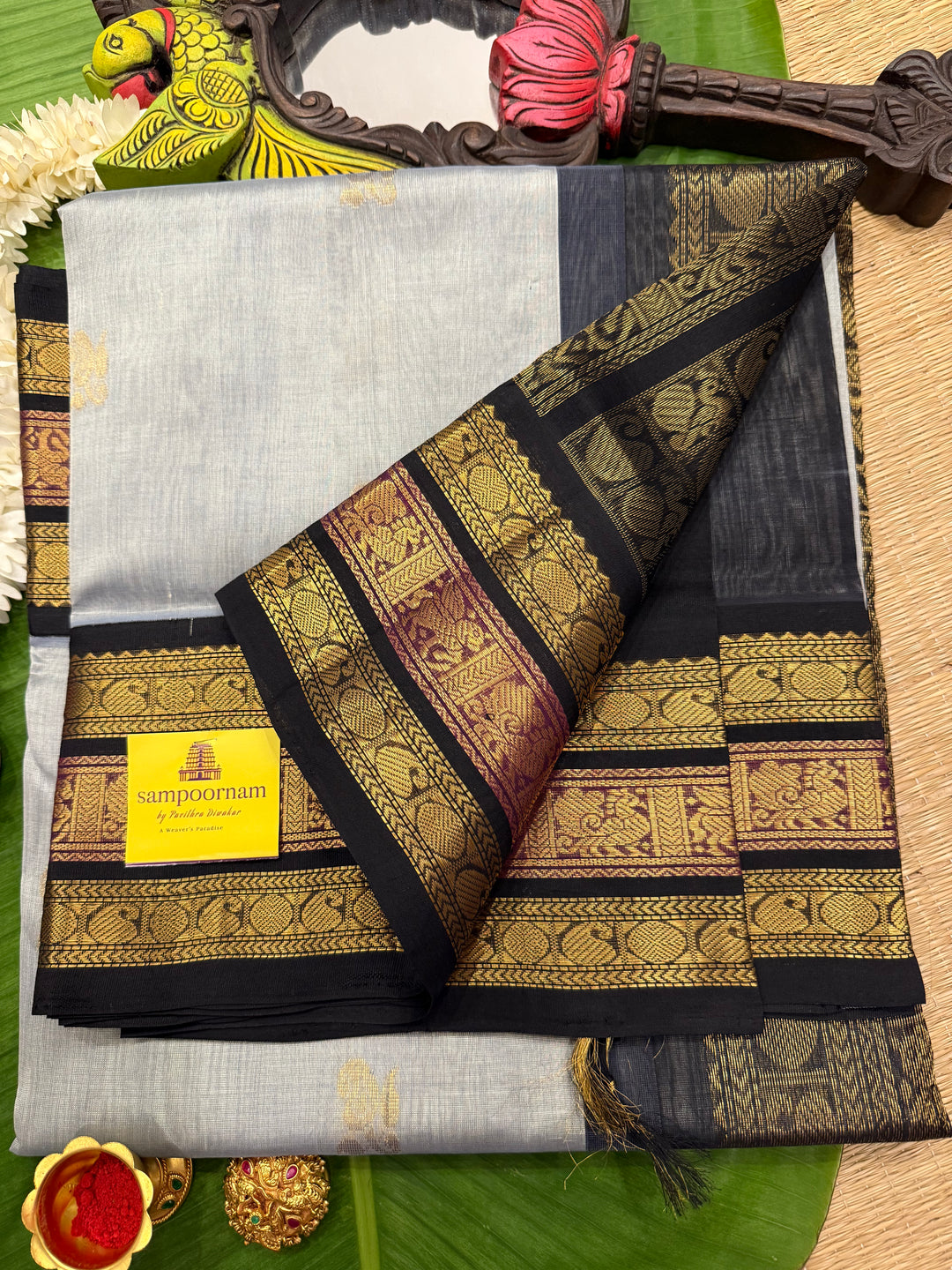 Grey with Black Rich Zari Butta in the body , Kanchi border and rich pallu Korvai Silk Cotton Saree