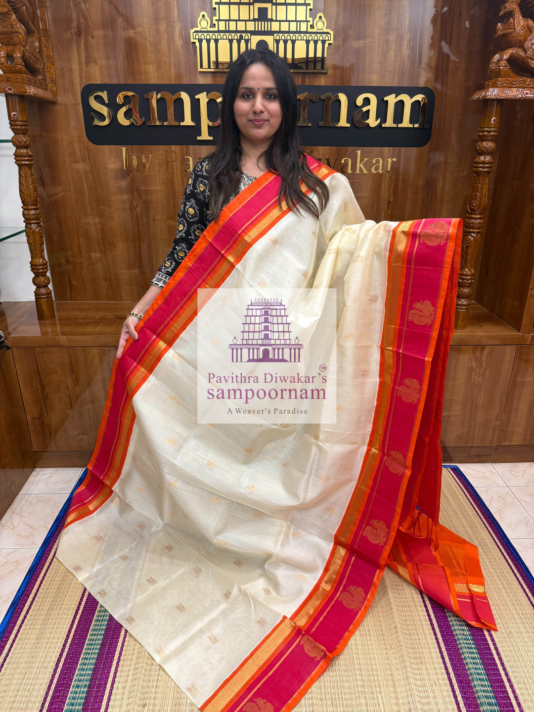 Offwhite with Orange, Rich Zari Butta in the Body, Traditional Borders with Peacock Motifs and Grand Pallu Korvai Silk Cotton Saree