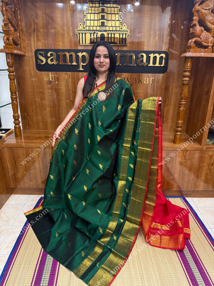 Green with Red , Zari Parrot motif in the body and  One side big rettapet border , grand Pallu Silk Cotton Saree