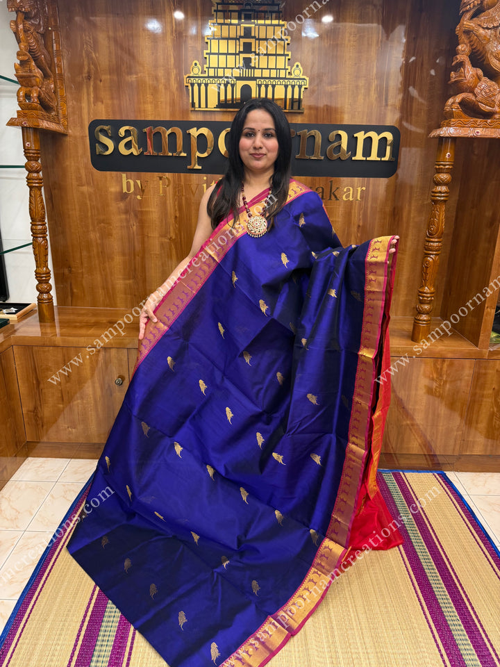 Blue with Red  , Zari Parrot motif in the body and  traditional border , grand Pallu Silk Cotton Saree