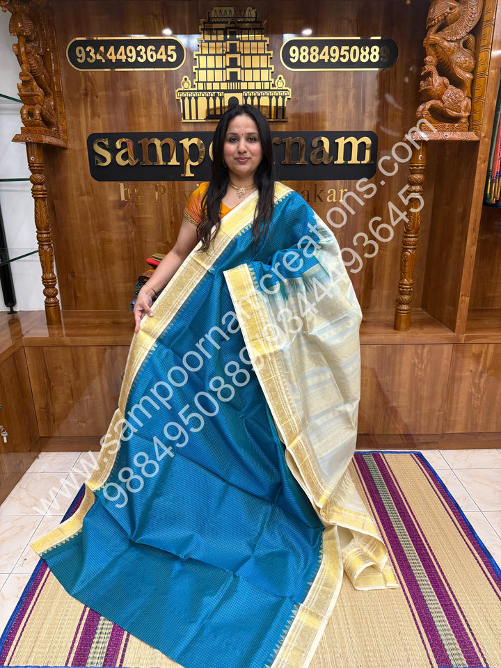 Ocean Blue with Offwhite ,  Rich Zari Checks in the body and Traditional  Border , Grand Pallu Pure Korvai Silk Cotton Saree