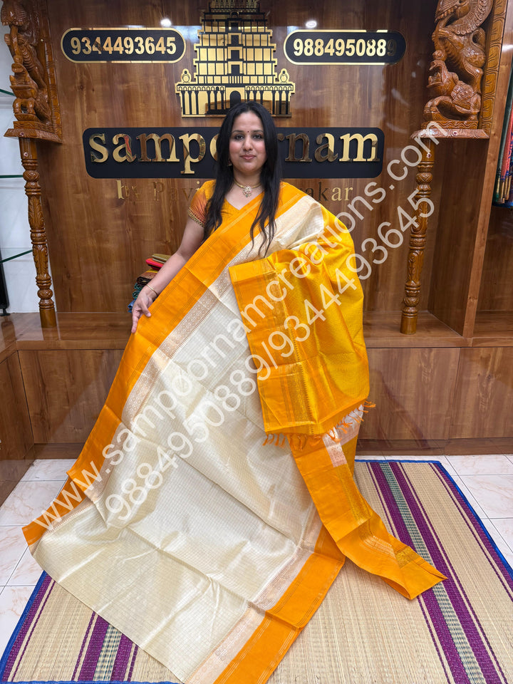 Offwhite with  yellow , Rich Zari Checks in the body and Rettapet Border , Grand Pallu Pure Korvai Silk Cotton Saree