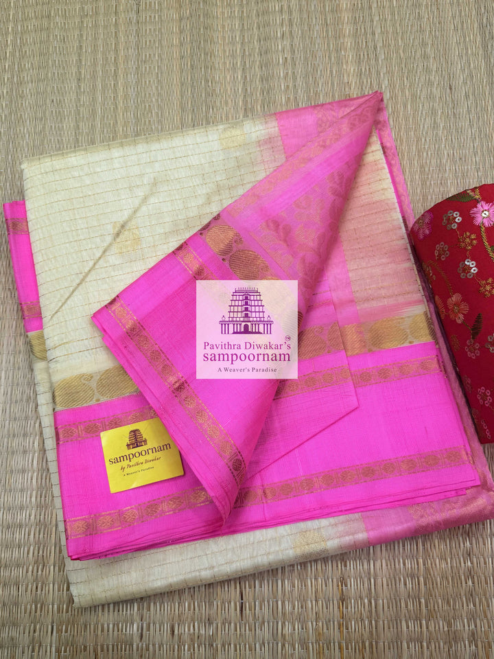Cream with Baby Pink , Rich Zari checks and Annam Zari butta in the body , Rettapet border and Rich Pallu Korvai Silk Cotton Saree