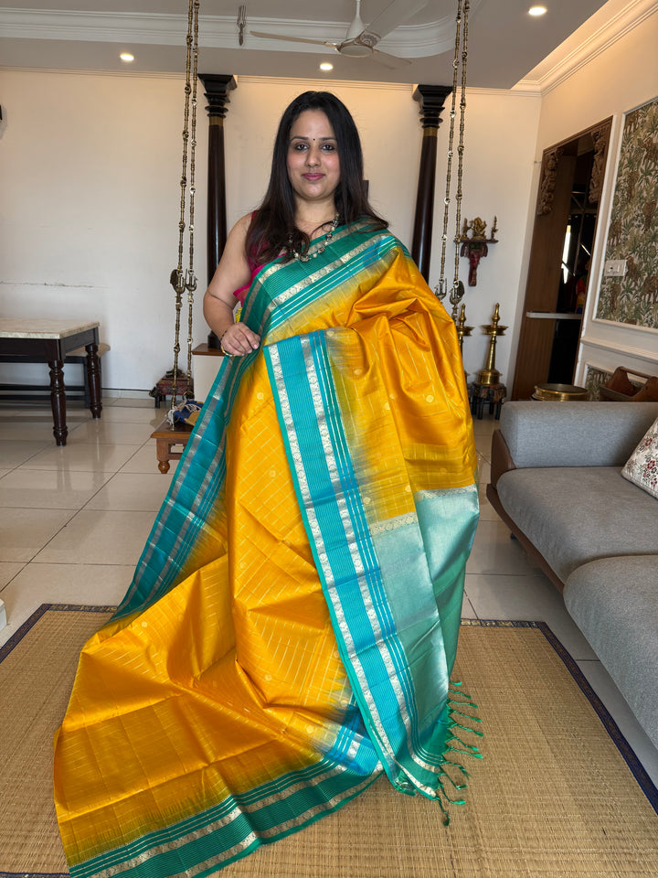 Yellow With Turquoise Blue ,zari butta with zari checks all over the body rettapet traditional borders and rich pallu Pure Soft Silk Sarees