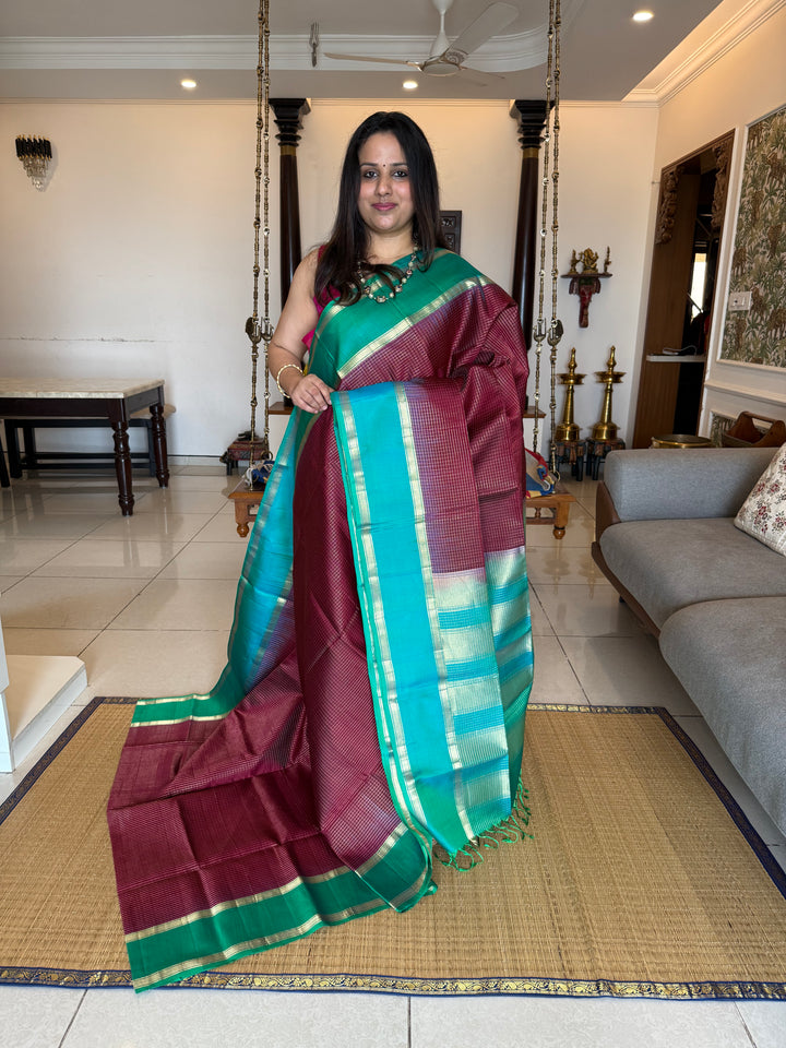 Dark Jamun  With Turquoise Blue ,rich zari podi kattam in the body,traditional rettapet borders and rich Pallu Pure Soft Silk Saree