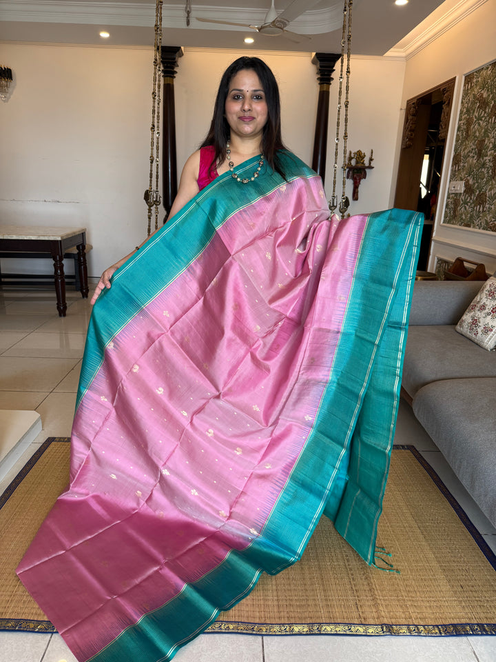 Onion Pink With Turquoise Blue Colour ,vairaoosi lines in the border, rich zari butta in the body and grand traditional Pallu Pure Soft Silk Saree