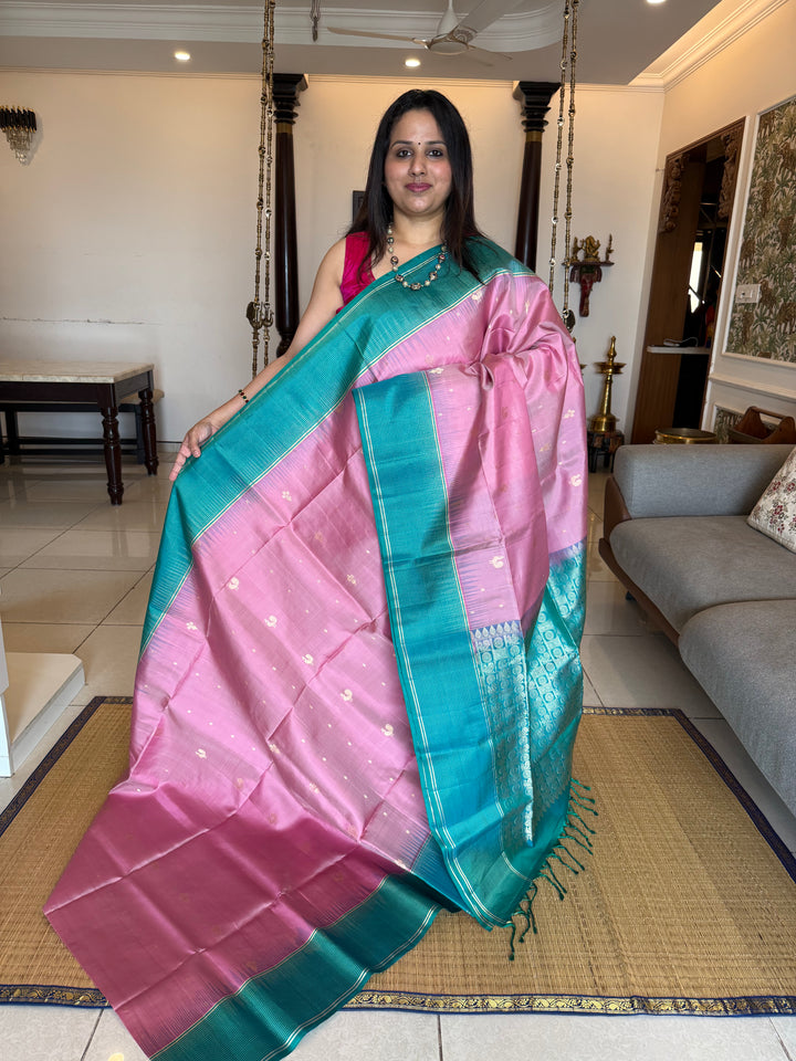 Onion Pink With Turquoise Blue Colour ,vairaoosi lines in the border, rich zari butta in the body and grand traditional Pallu Pure Soft Silk Saree