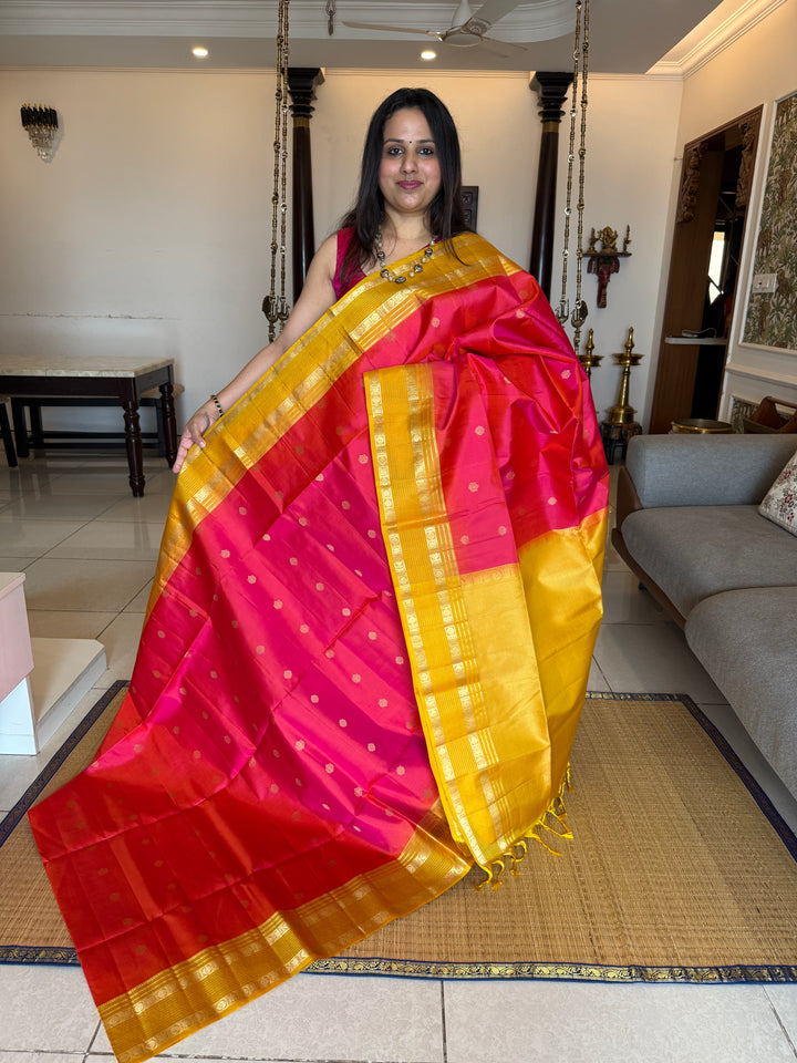 Reddish Pink With Yellow, traditional rettapet border, rich zari butta in the body and grand pallu Pure Soft Silk Sarees