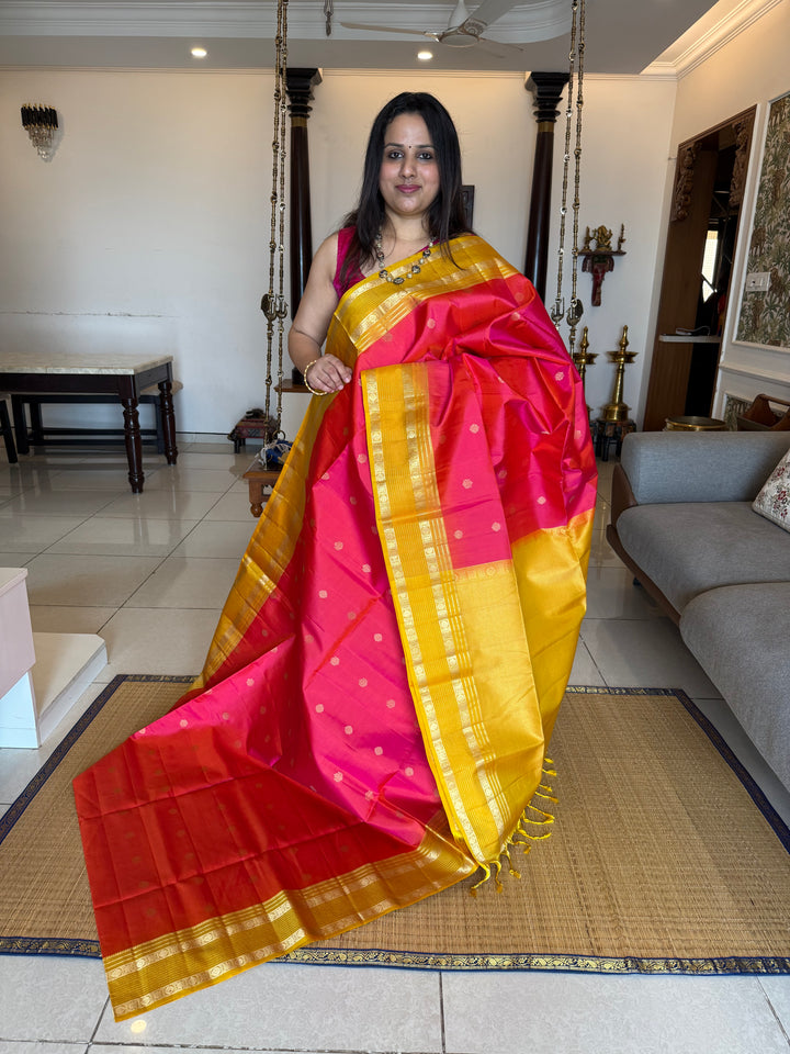 Reddish Pink With Yellow, traditional rettapet border, rich zari butta in the body and grand pallu Pure Soft Silk Sarees