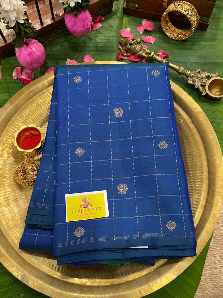 A Traditional Mayilkazhuthu Blue with Mayil Chakram Body Checks Butta and Traditional Pallu - Pure Kanjivaram Silk Saree