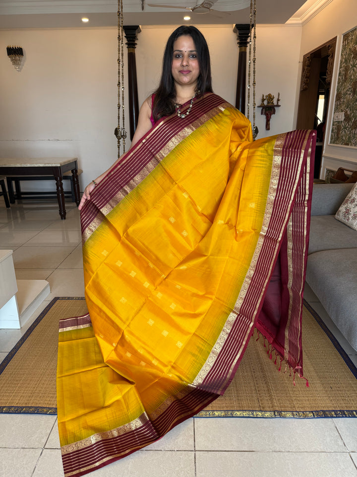 Manjal With Maroon,  traditional rettapet border, rich zari butta in the body and grand pallu Pure Soft Silk Saree