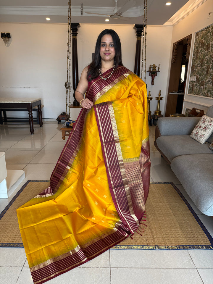 Manjal With Maroon,  traditional rettapet border, rich zari butta in the body and grand pallu Pure Soft Silk Saree