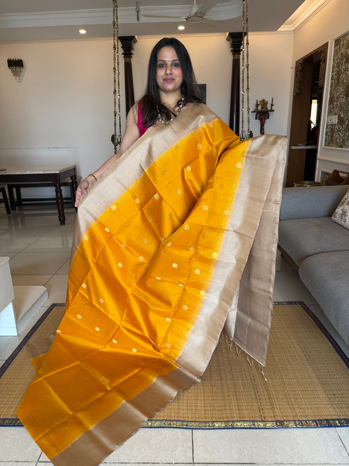 Musturd with Beige  , rich Annam and chakram  zari butta in the body and an elaborate rich Pallu Pure Soft Silk Saree