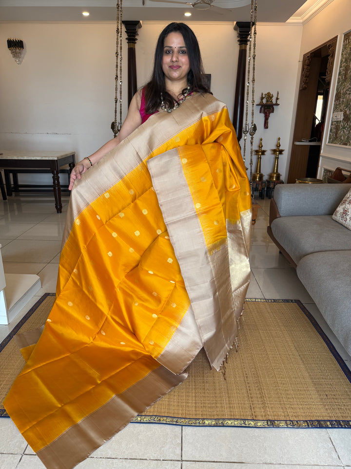 Musturd with Beige  , rich Annam and chakram  zari butta in the body and an elaborate rich Pallu Pure Soft Silk Saree