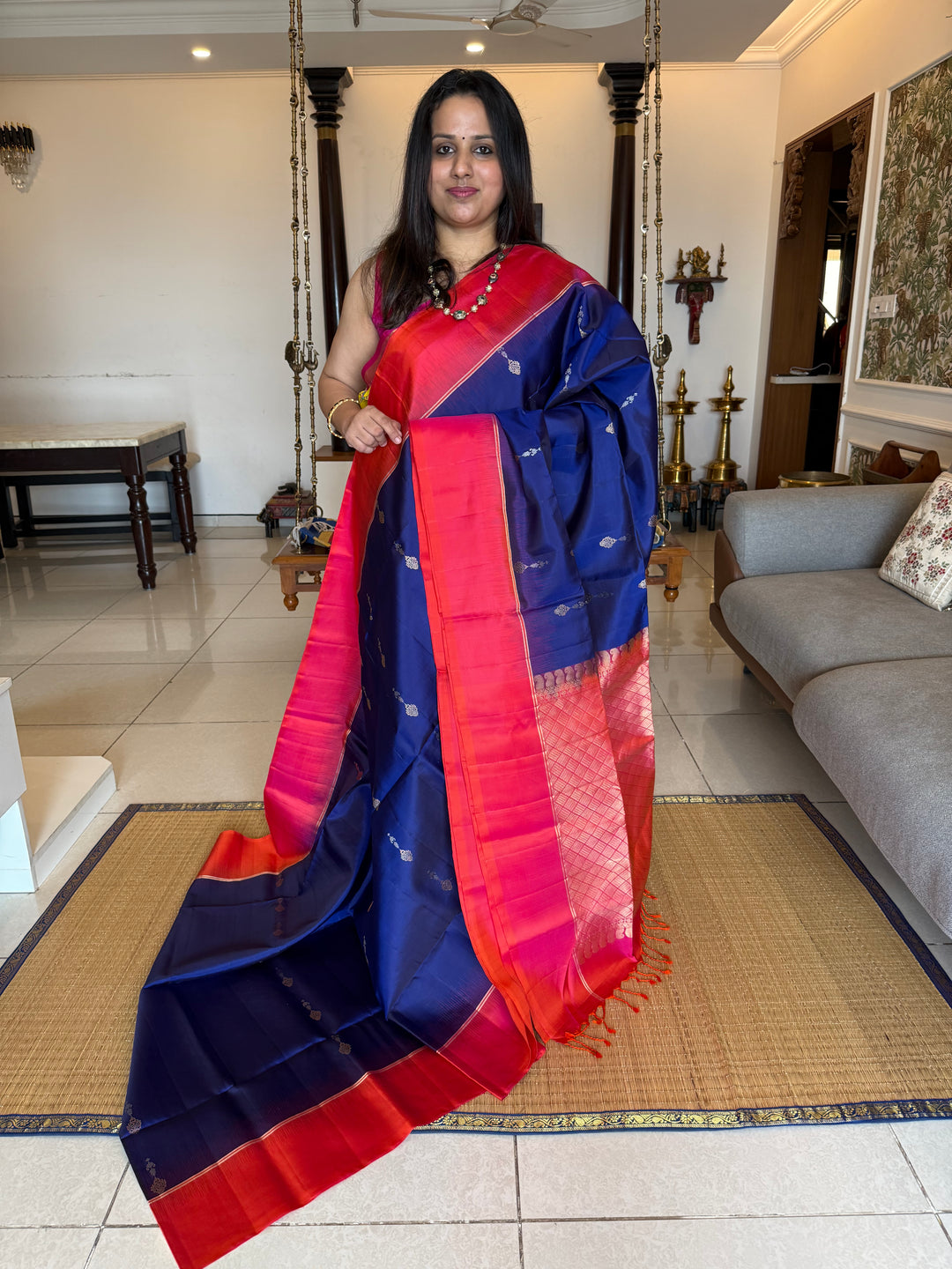 Dark Blue with Reddish Pink , rich silver and gold zari butta in the body and an elaborate rich Pallu Pure Soft Silk Saree