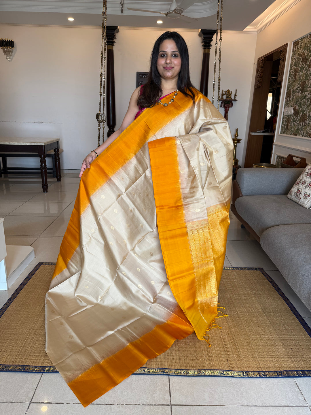Offwhite with Mustard ,rich zari butta in the body and an elaborate rich Pallu Pure Soft Silk Saree