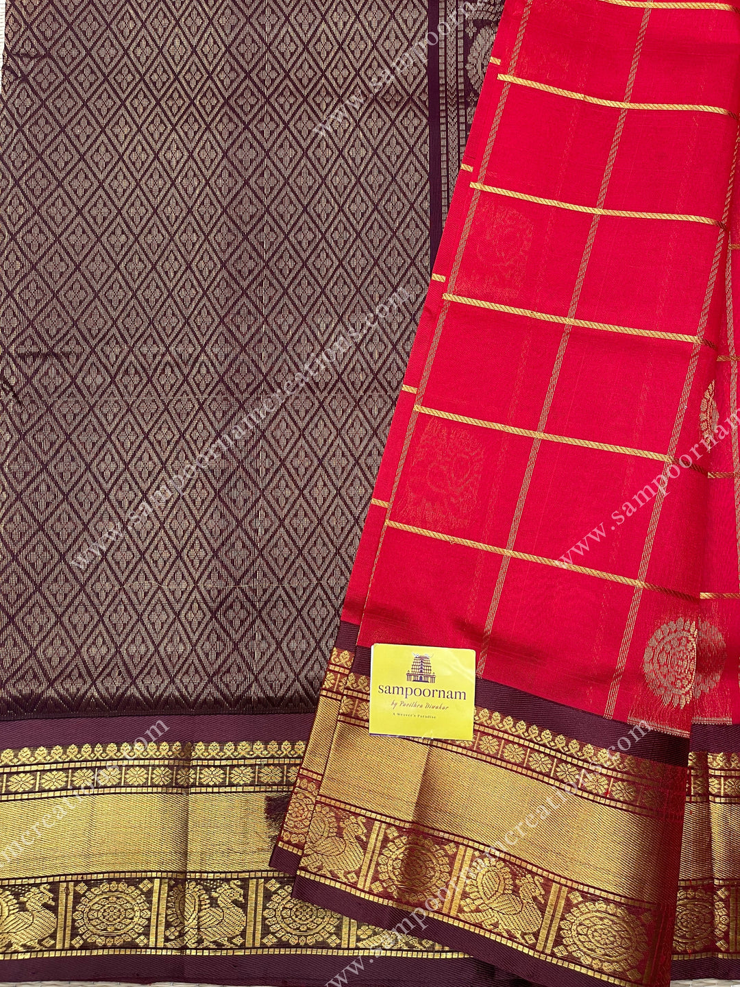 Red with Brown  , rich Zari checks in the body , Mayil and Chakram rich butta in the body , traditional border and  rich Pallu Silk Cotton Saree