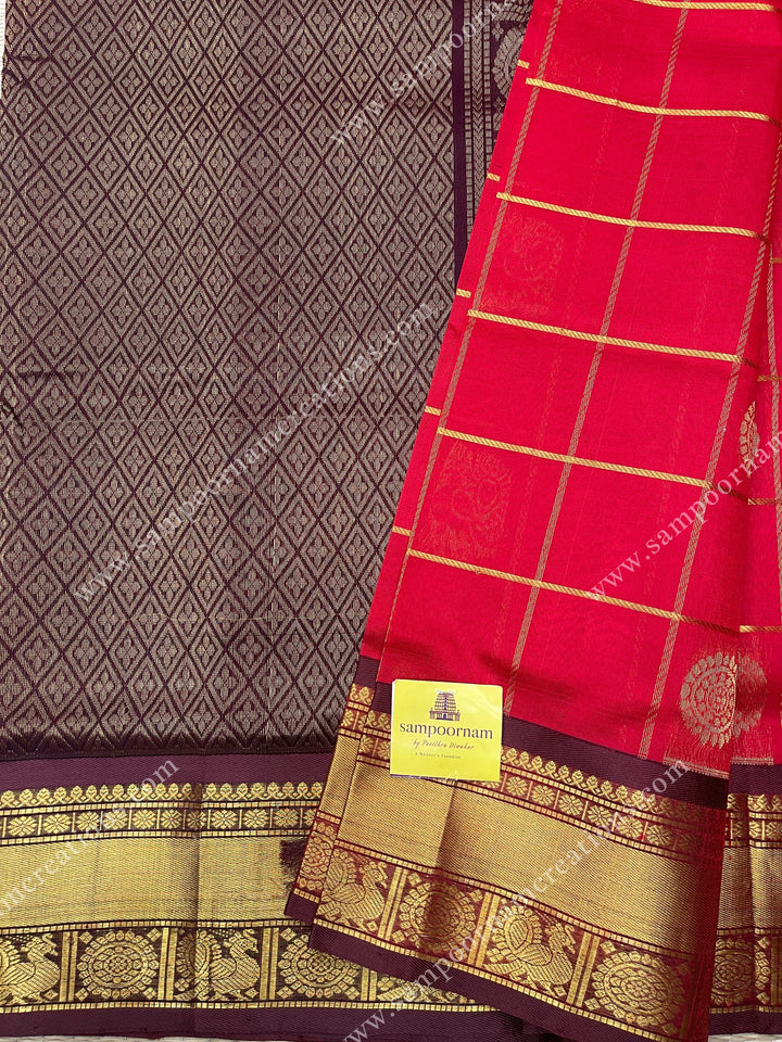 Red with Brown  , rich Zari checks in the body , Mayil and Chakram rich butta in the body , traditional border and  rich Pallu Silk Cotton Saree
