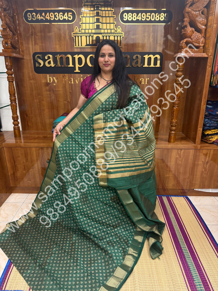 Dark Green , Floral Prints in the body .Tissue Pallu and Printed Blouse Semi Tussar Saree
