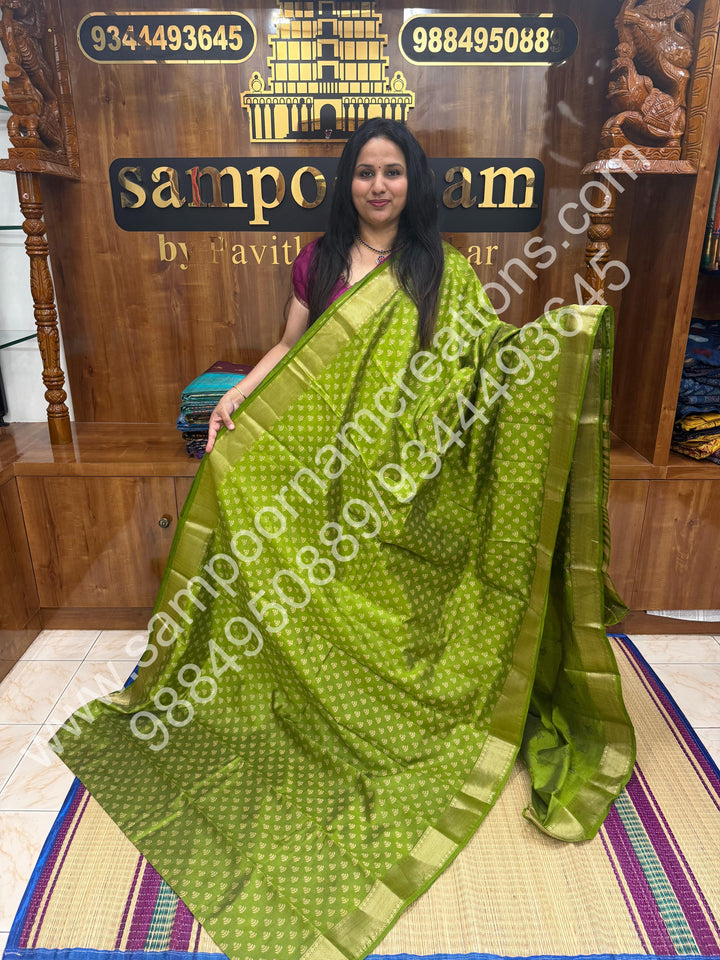 Light Green , Floral Prints in the body .Tissue Pallu and Printed Blouse Semi Tussar Saree