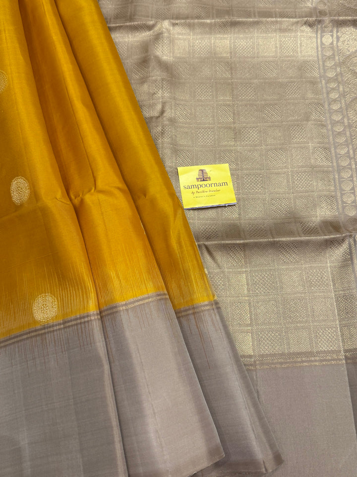 Musturd with Beige  , rich Annam and chakram  zari butta in the body and an elaborate rich Pallu Pure Soft Silk Saree