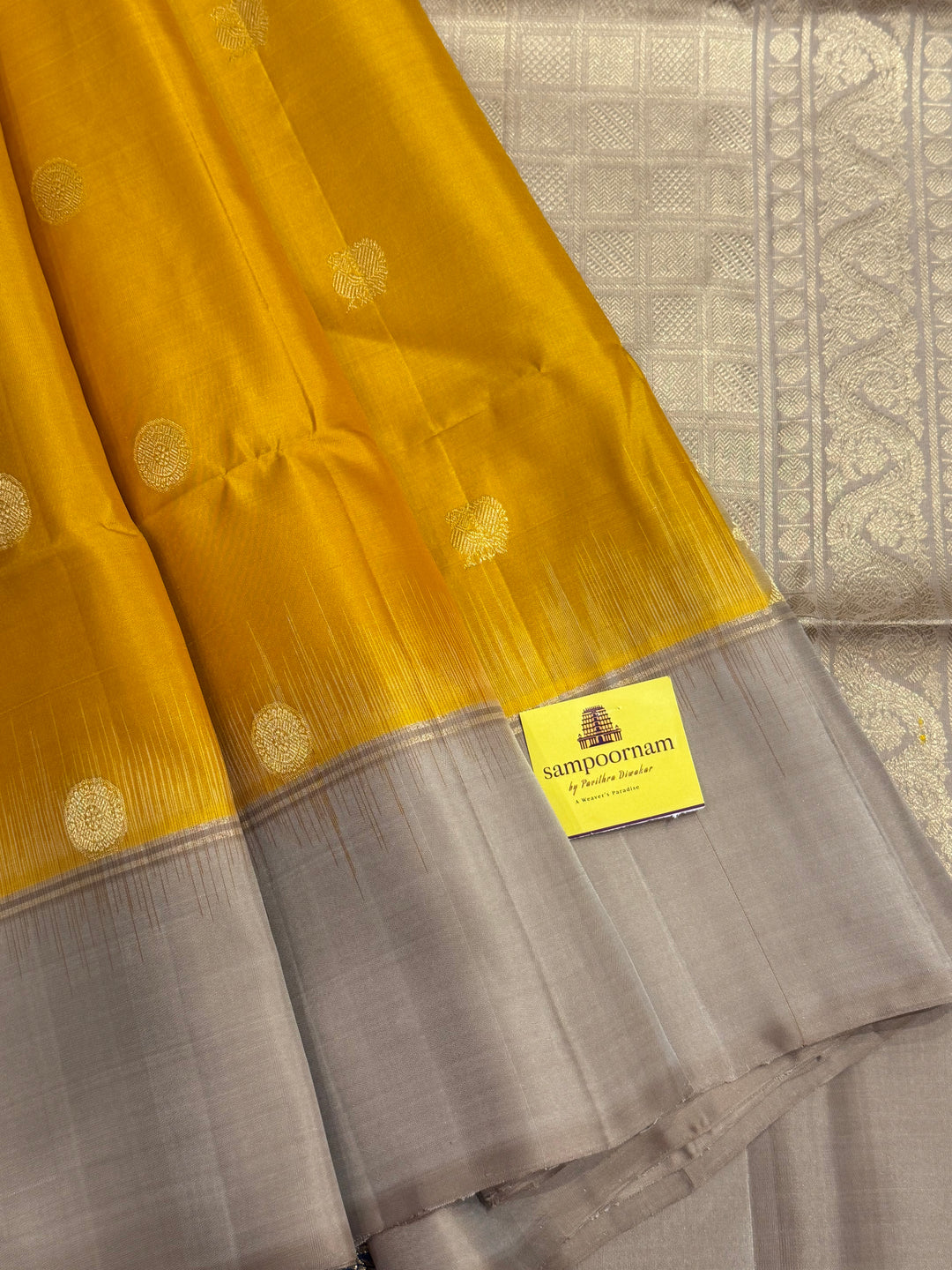 Musturd with Beige  , rich Annam and chakram  zari butta in the body and an elaborate rich Pallu Pure Soft Silk Saree