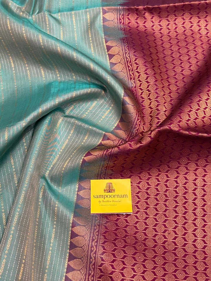 Light Rama Blue with Purple , rich zari vertical line all over the body , traditional checks border and grand Pallu Pure Soft Silk Saree