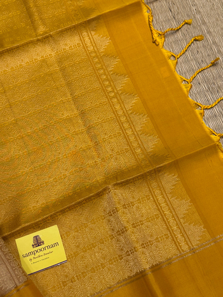 Offwhite with Mustard ,rich zari butta in the body and an elaborate rich Pallu Pure Soft Silk Saree