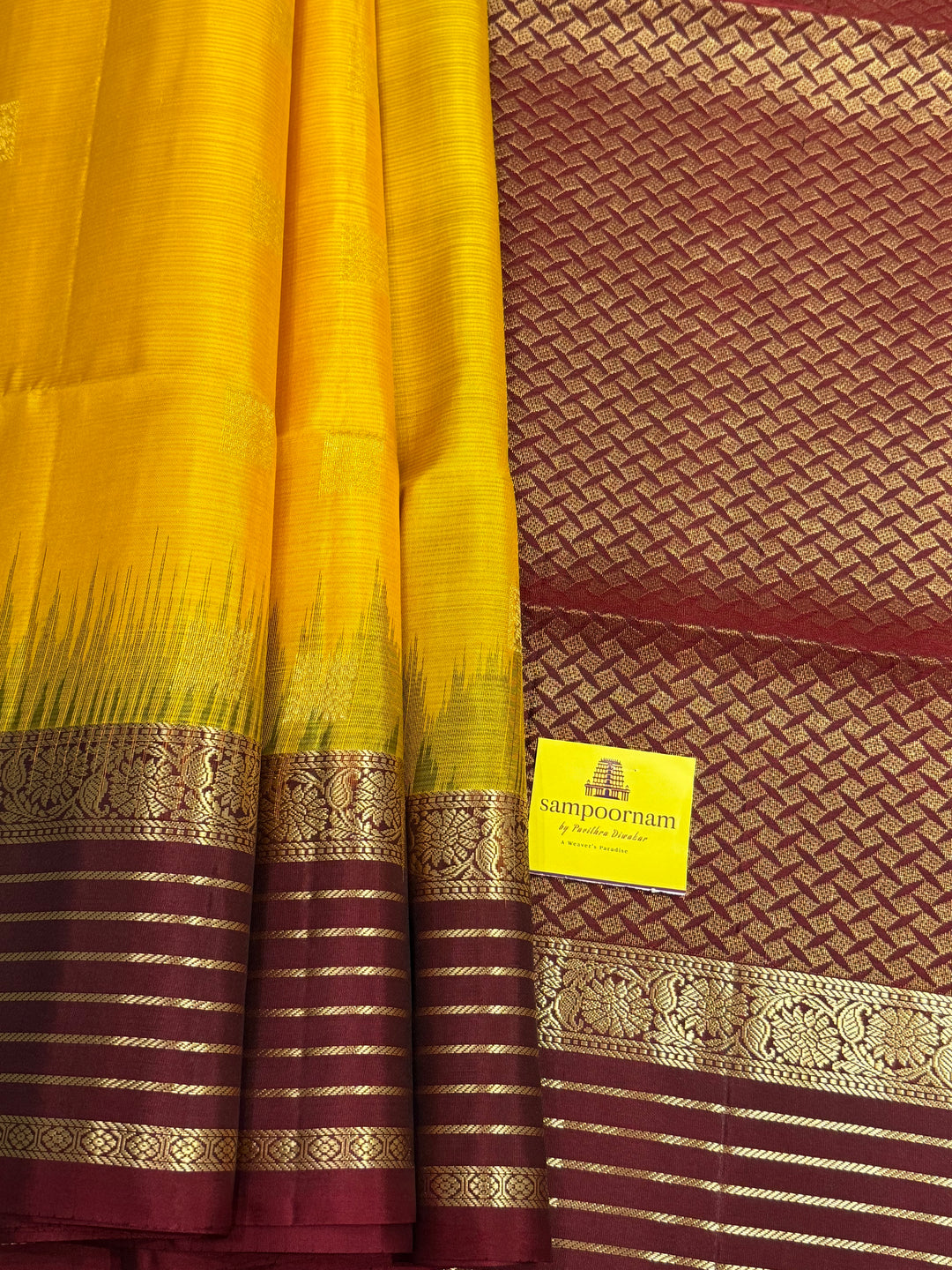 Manjal With Maroon,  traditional rettapet border, rich zari butta in the body and grand pallu Pure Soft Silk Saree