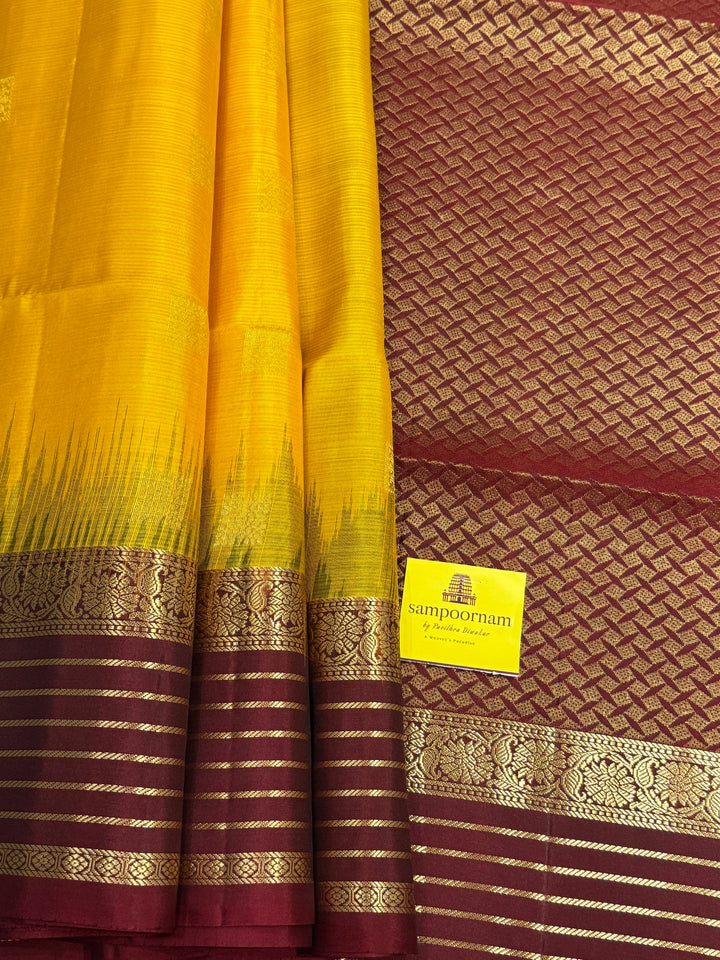 Manjal With Maroon,  traditional rettapet border, rich zari butta in the body and grand pallu Pure Soft Silk Saree