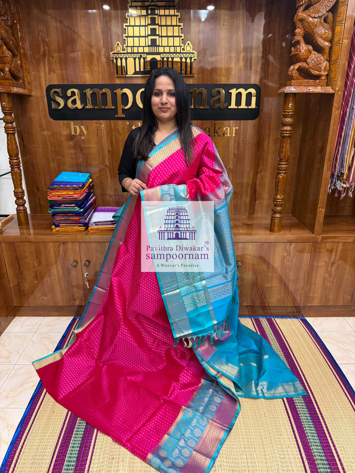 Rani Pink with Turquoise Blue , Zari butta in the body , one side big Satin border with Floral motif , traditional border and  Grand Pallu Korvai Silk Cotton Saree