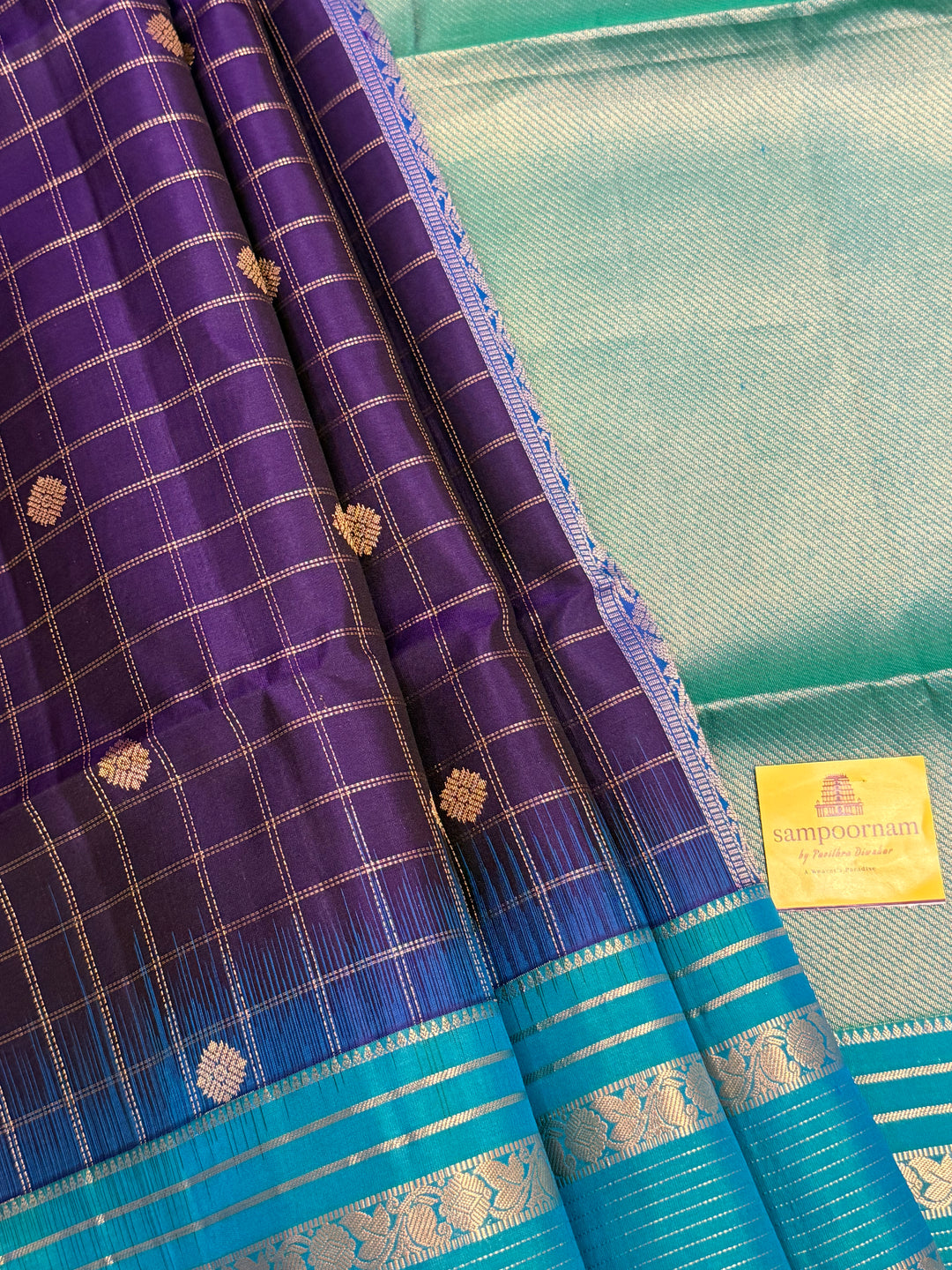Dark Blue with Light Blue, rich zari butta with zari checks all over the body, Rettapet traditional borders and rich Pallu Pure Soft Silk Saree