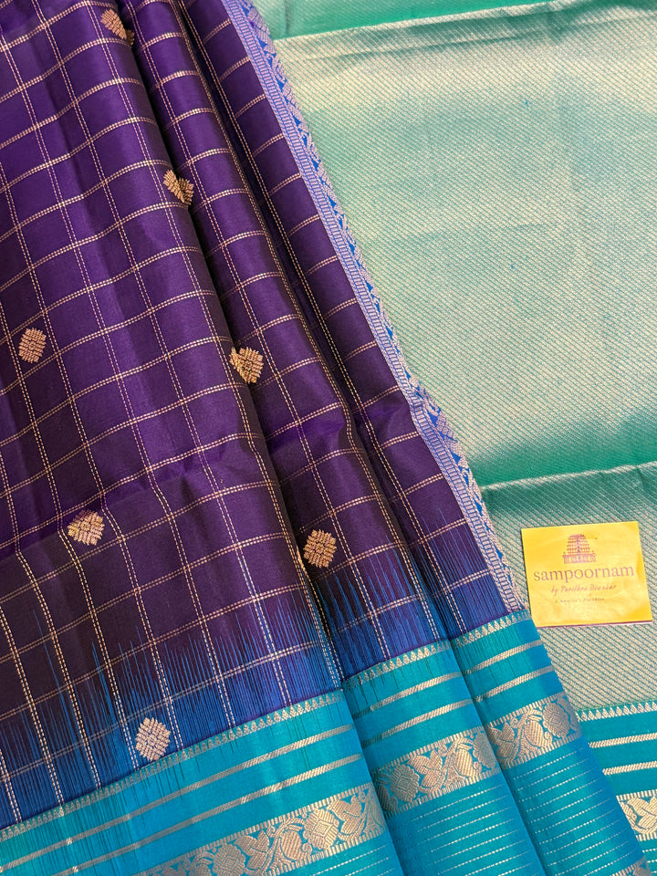 Dark Blue with Light Blue, rich zari butta with zari checks all over the body, Rettapet traditional borders and rich Pallu Pure Soft Silk Saree
