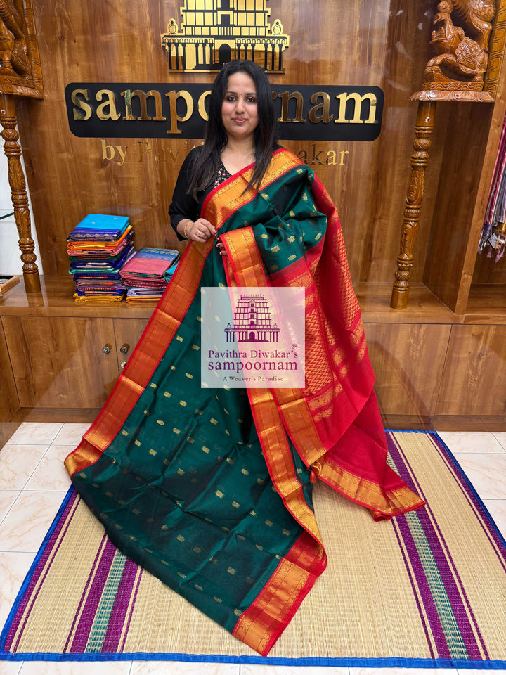 Dark Green with Red , Rich Zari butta in the body traditional Silk border and Rich Pallu Korvai Silk Cotton Saree