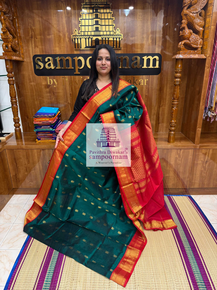 Dark Green with Red , Rich Zari butta in the body traditional Silk border and Rich Pallu Korvai Silk Cotton Saree