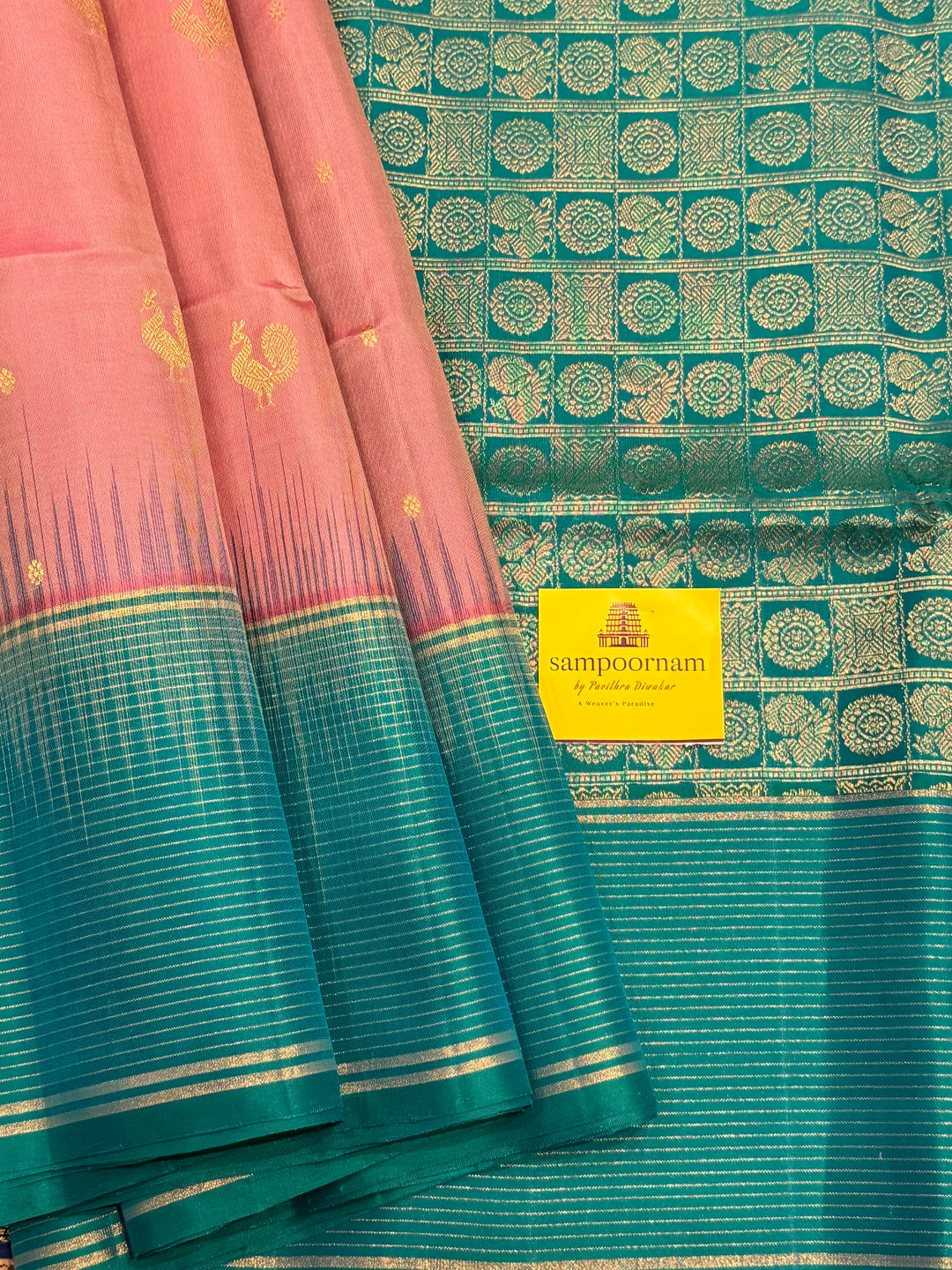 Onion Pink With Turquoise Blue Colour ,vairaoosi lines in the border, rich zari butta in the body and grand traditional Pallu Pure Soft Silk Saree