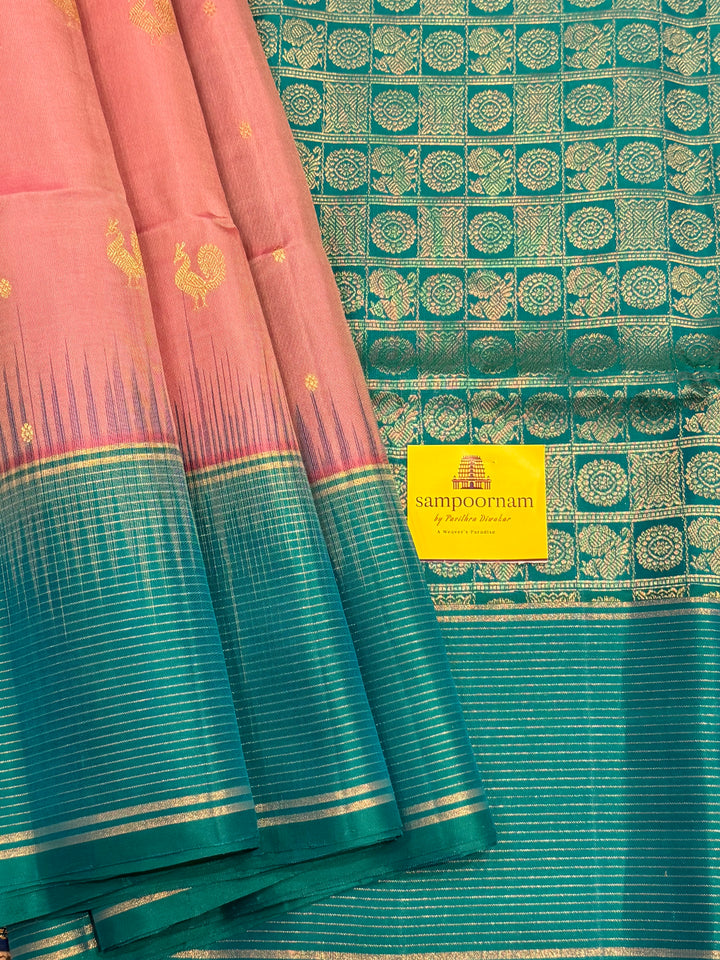 Onion Pink With Turquoise Blue Colour ,vairaoosi lines in the border, rich zari butta in the body and grand traditional Pallu Pure Soft Silk Saree