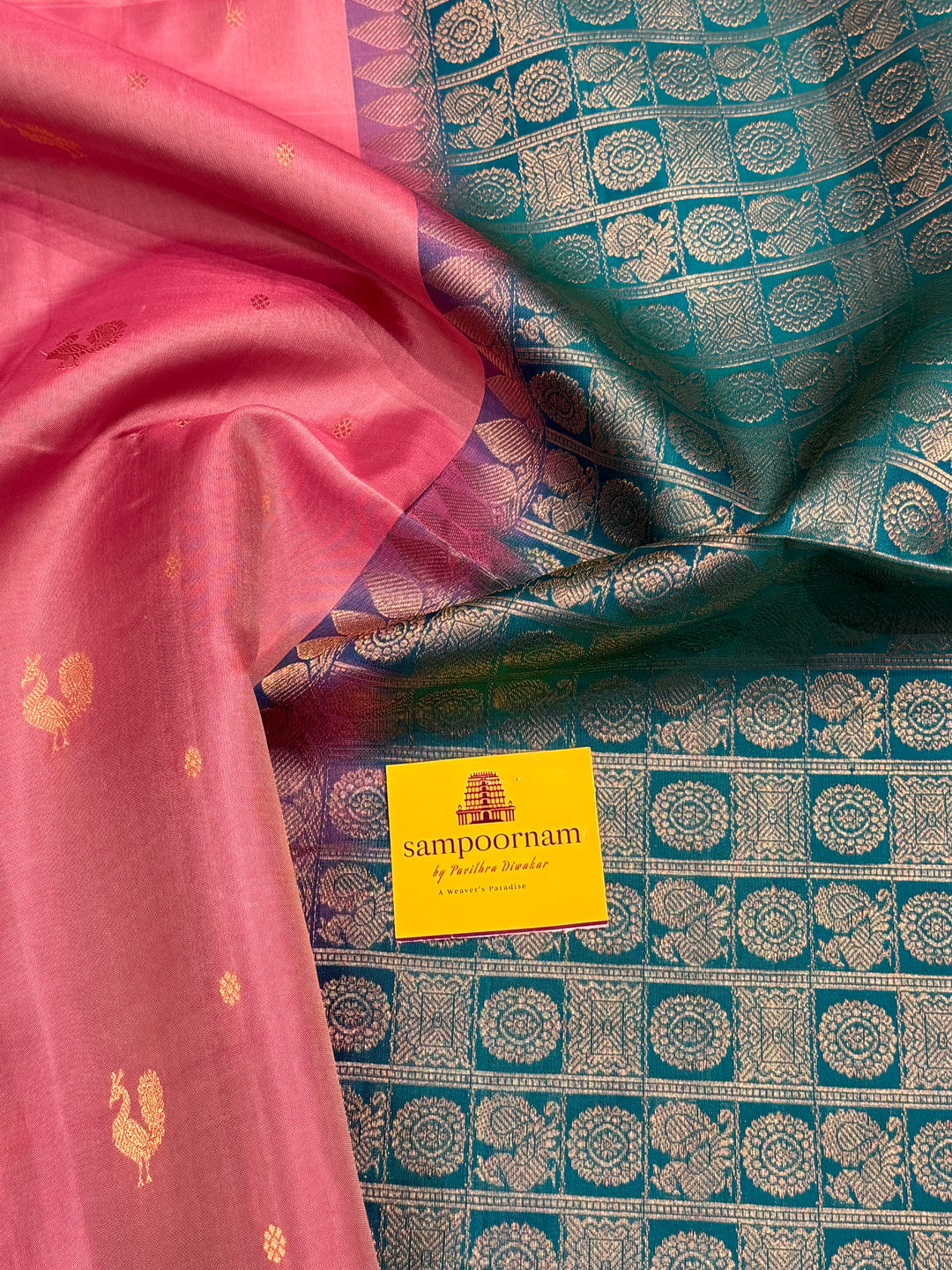 Onion Pink With Turquoise Blue Colour ,vairaoosi lines in the border, rich zari butta in the body and grand traditional Pallu Pure Soft Silk Saree