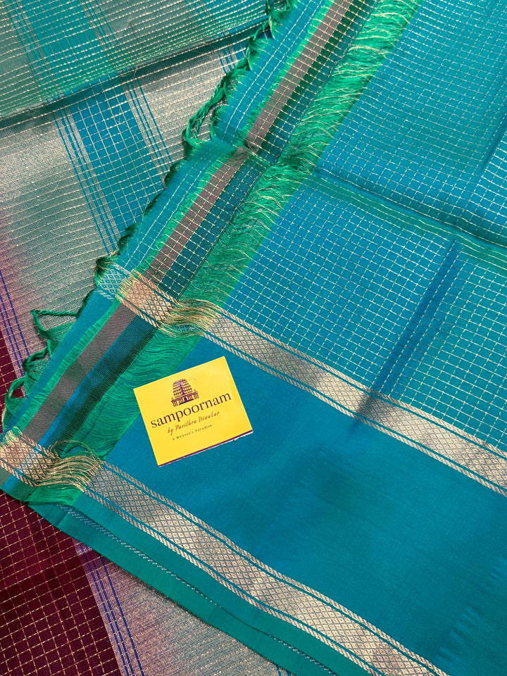 Dark Jamun  With Turquoise Blue ,rich zari podi kattam in the body,traditional rettapet borders and rich Pallu Pure Soft Silk Saree