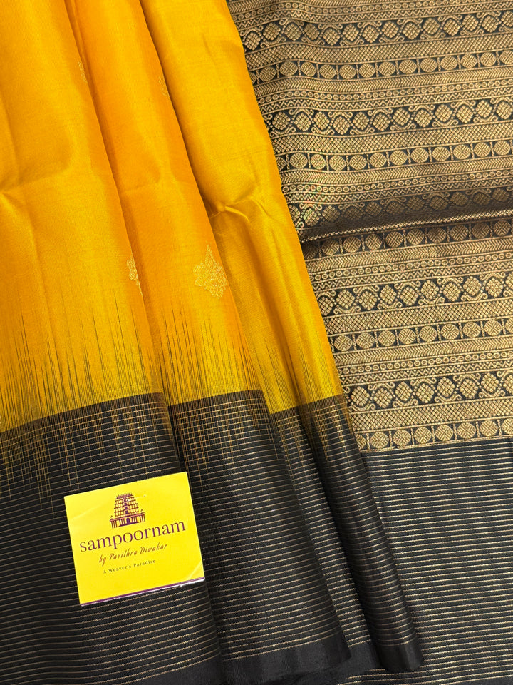 Manjal With Black vairasoosi lines in the border, rich  zari butta in the body and grand traditional Pallu Pure Soft Silk Saree