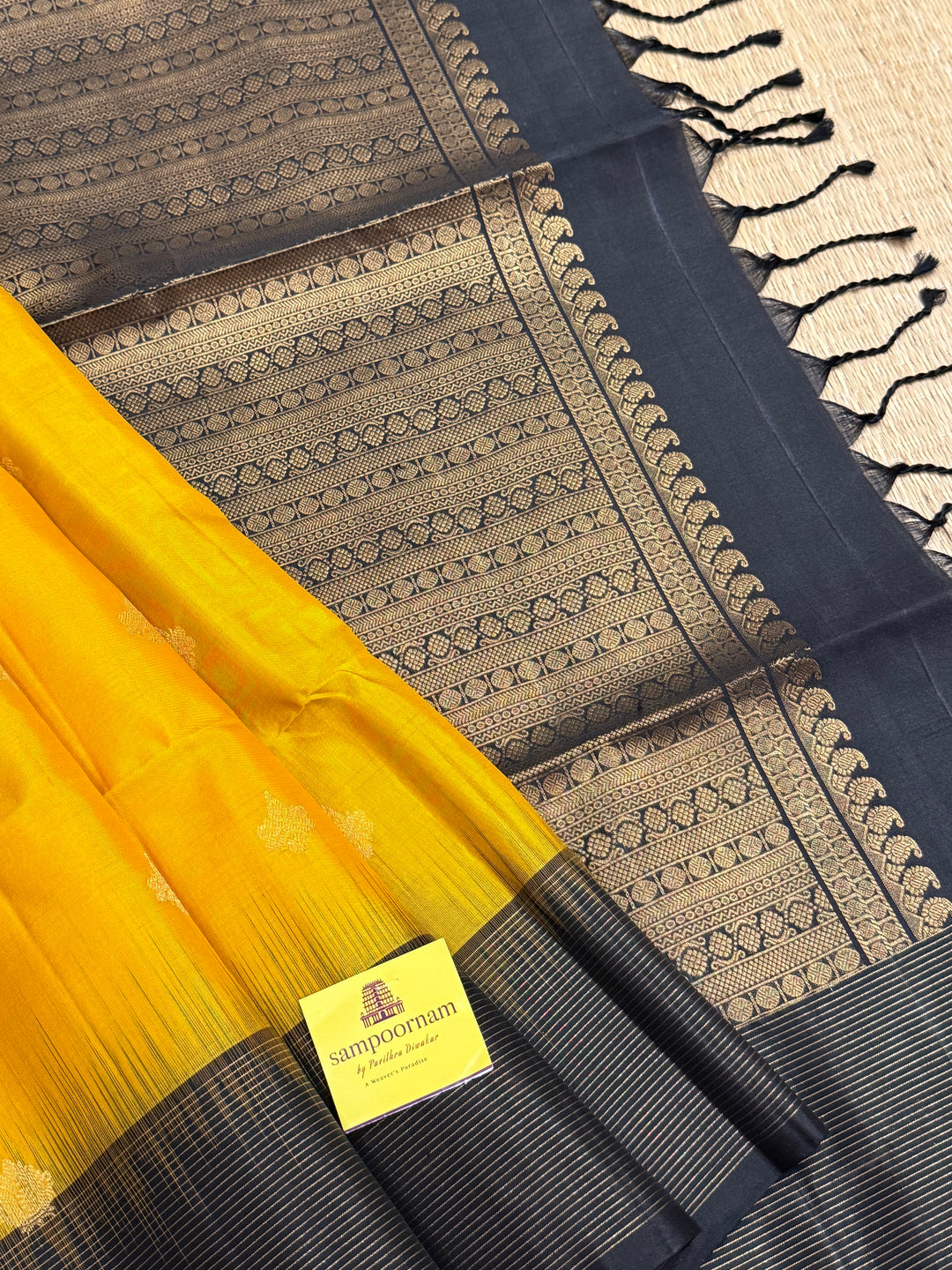 Manjal With Black vairasoosi lines in the border, rich  zari butta in the body and grand traditional Pallu Pure Soft Silk Saree