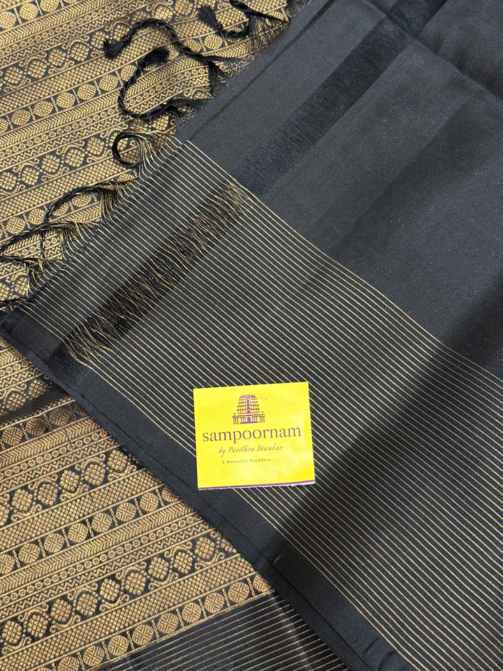 Manjal With Black vairasoosi lines in the border, rich  zari butta in the body and grand traditional Pallu Pure Soft Silk Saree