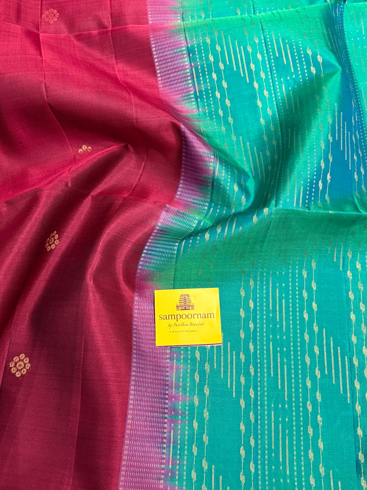 Deep Maroon With Turquoise Blue , rich annam butta in the lower border and small zari buttas in the body, rich Pallu Pure Soft Silk Saree