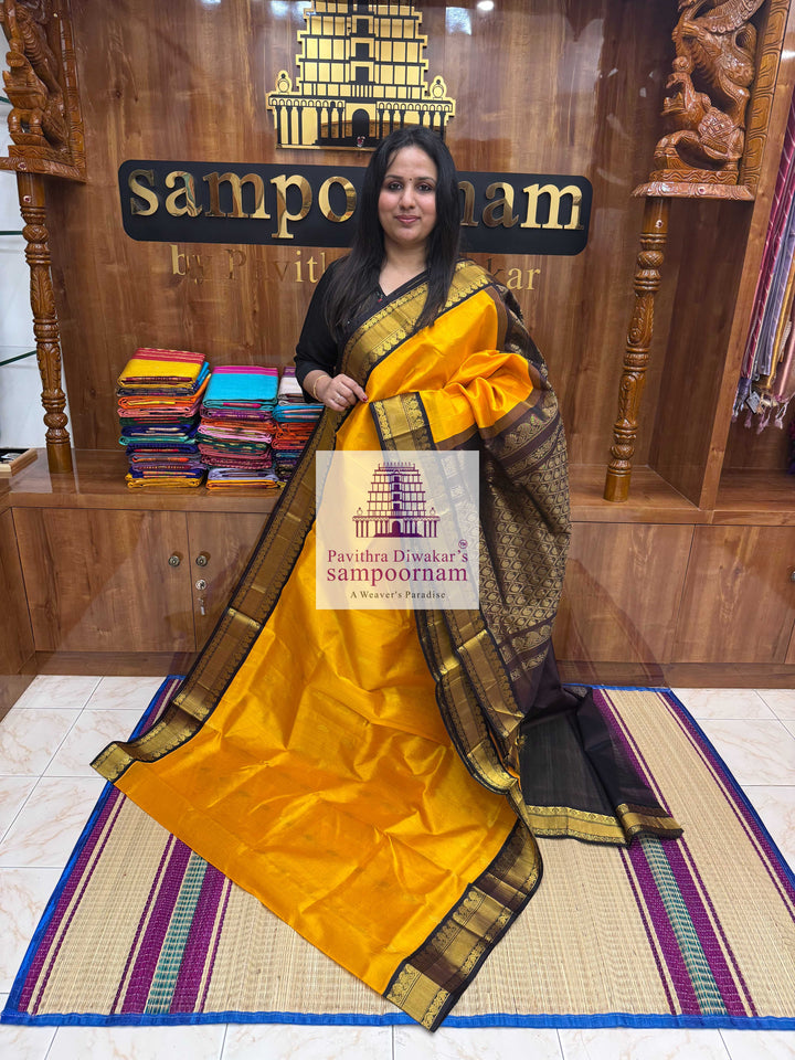 Mambazha Manjal with Dark Brown  , Rich Zari butta in the body traditional Silk border and Rich Pallu Korvai Silk Cotton Saree