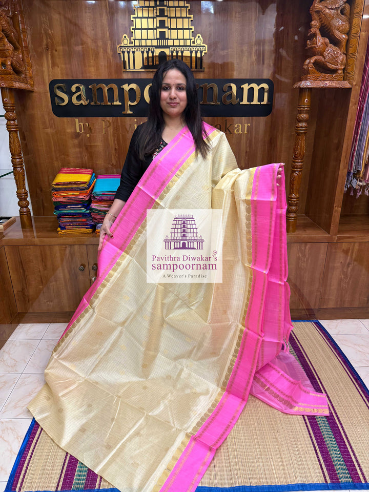 Cream with Baby Pink , Rich Zari checks and Annam Zari butta in the body , Rettapet border and Rich Pallu Korvai Silk Cotton Saree