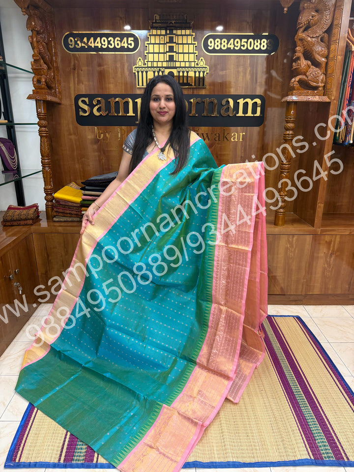 Turquoise Blue with Baby Pink , Rich Zari checks with Floral butta  and Traditional one side long border ,  rich Pallu Pure Korvai Silk Cotton Saree