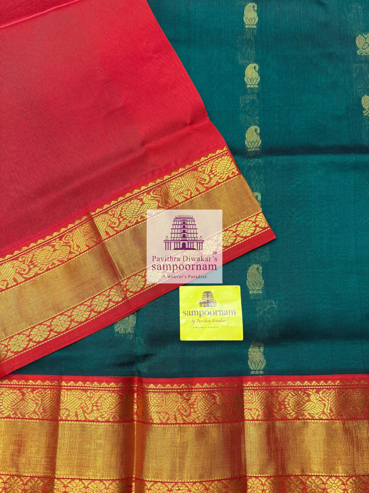 Dark Green with Red , Rich Zari butta in the body traditional Silk border and Rich Pallu Korvai Silk Cotton Saree
