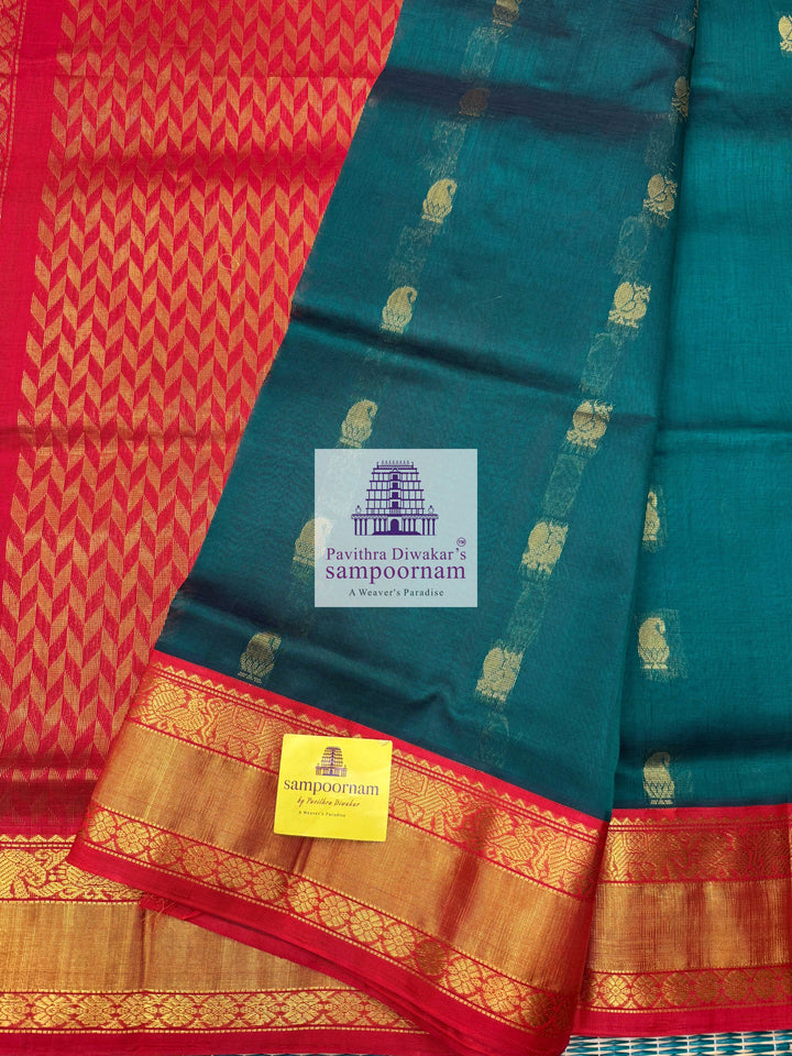 Dark Green with Red , Rich Zari butta in the body traditional Silk border and Rich Pallu Korvai Silk Cotton Saree