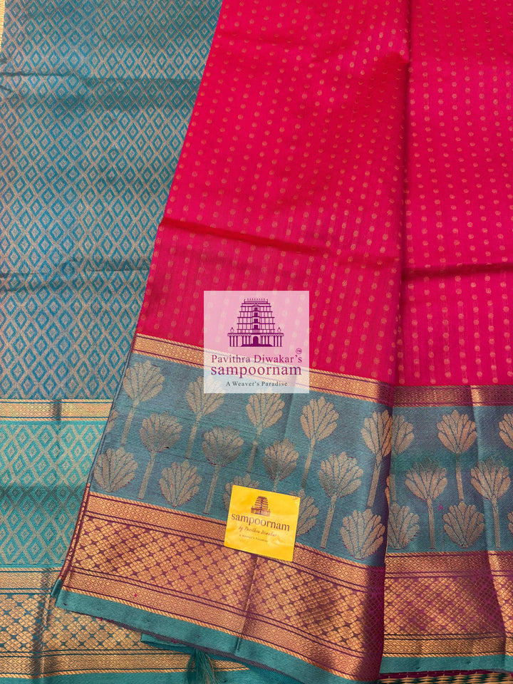 Rani Pink with Turquoise Blue , Zari butta in the body , one side big Satin border with Floral motif , traditional border and  Grand Pallu Korvai Silk Cotton Saree