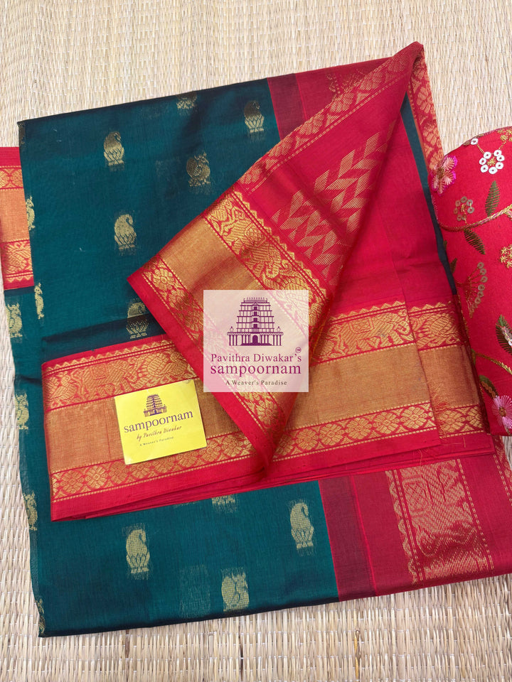 Dark Green with Red , Rich Zari butta in the body traditional Silk border and Rich Pallu Korvai Silk Cotton Saree